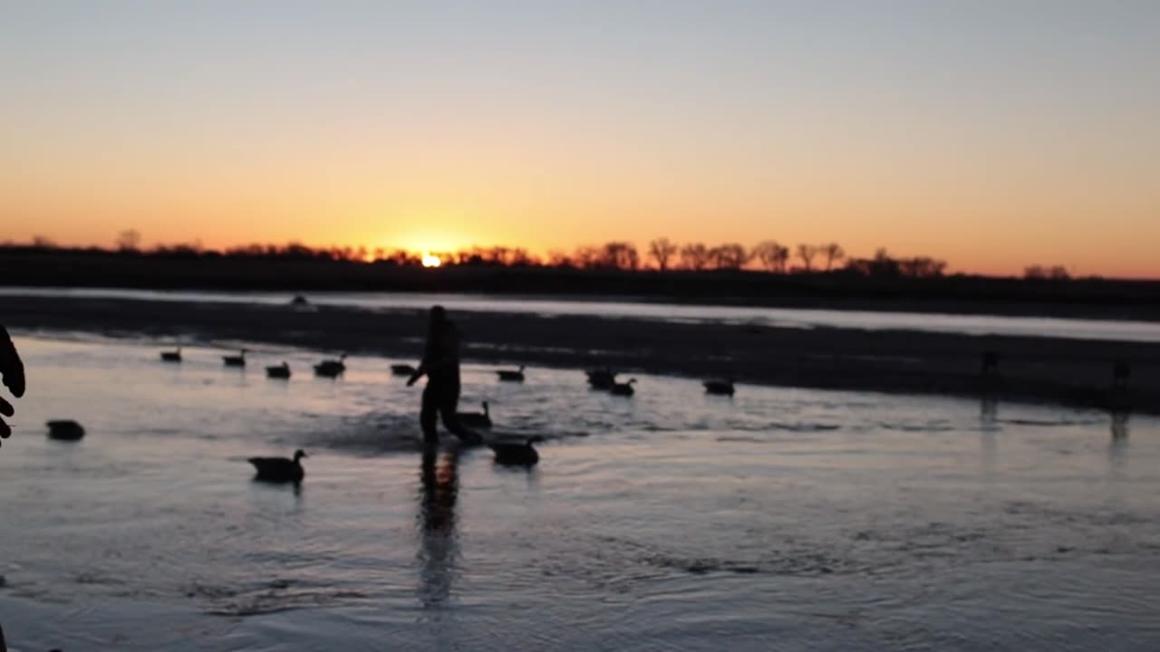 Waterfowl hunters and decoys on the Platte River at sunrise near River Lodge Outfitters
